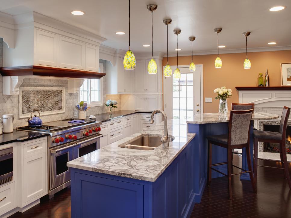 Neutral Transitional Kitchen With Blue Island and Raised Bar