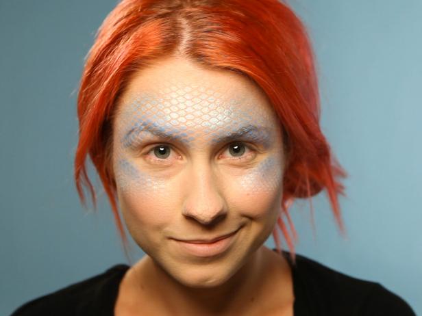 Gently remove the fishnet to reveal fish scales.