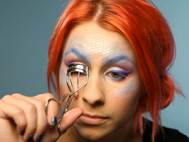 Curl lashes then coat them with mascara.