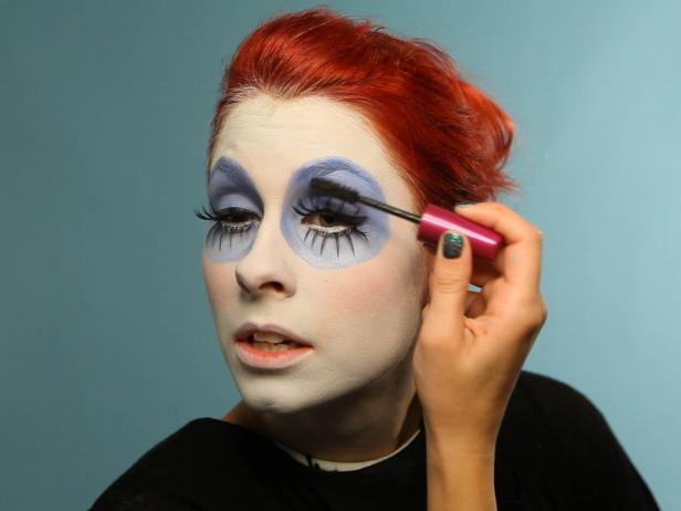 Blend the top false lashes to real lashes with mascara.