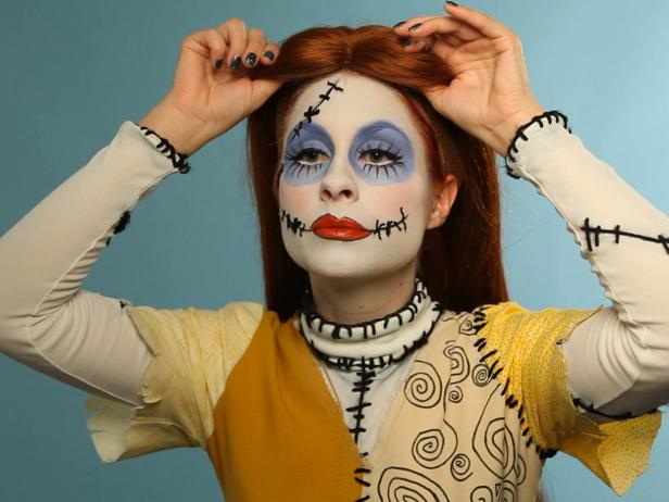Finish the look with a long auburn wig and costume. Once you are dressed, match the rest of your skin to your face.