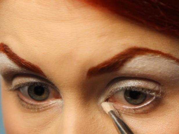 Start with a shimmery white eye shadow and apply everywhere the white liner was applied then blend it across your eyelid.