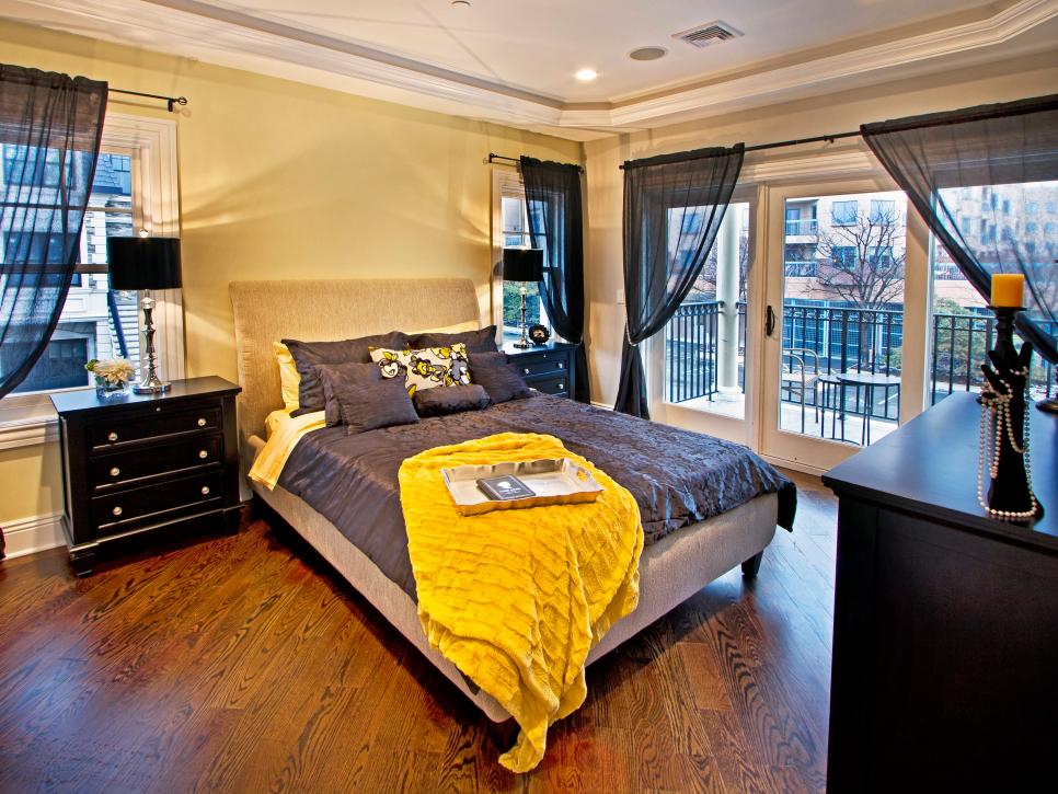 Black and Yellow Eclectic Bedroom With Patio View