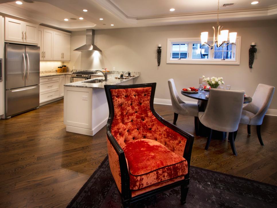 Open Concept Dining Room With Plush Orange Chair