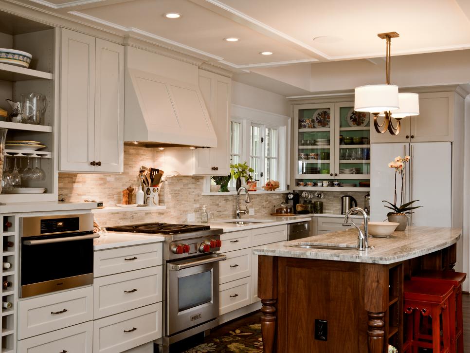 Traditional Kitchen With White Cabinets and Wood Island