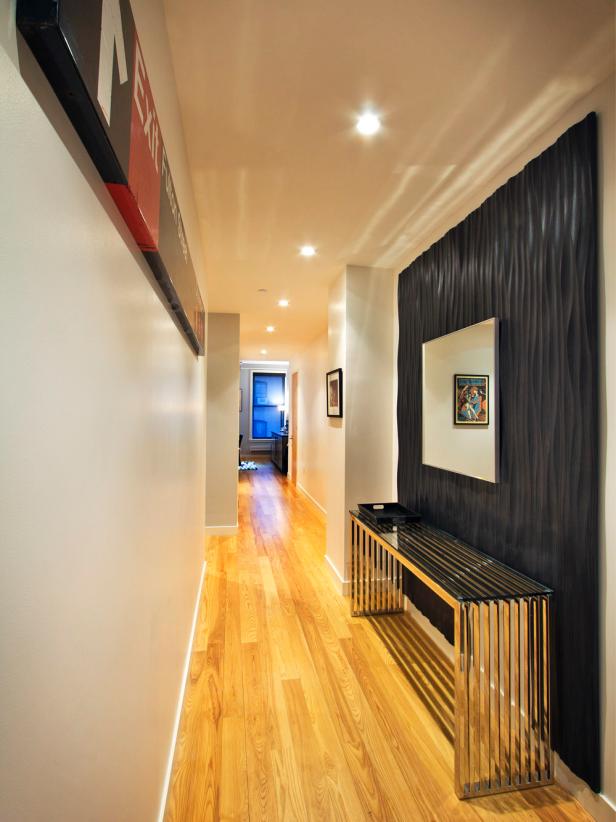 Entryway With Black Accent Wall & Metallic Console Table Entryway With Black Accent Wall & Metallic Console Table