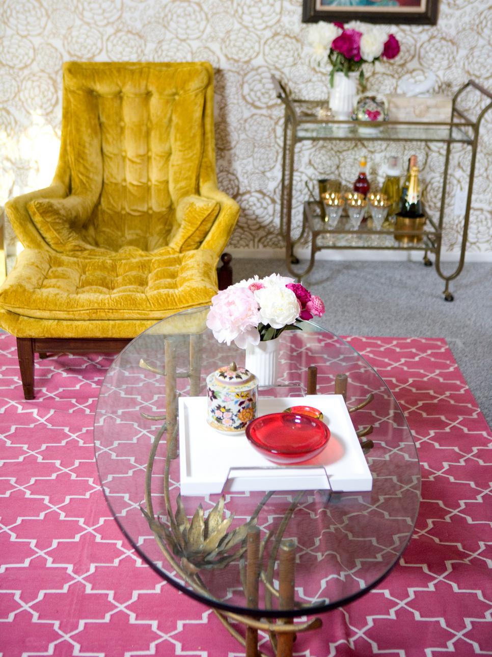 Gold chair with pink rug