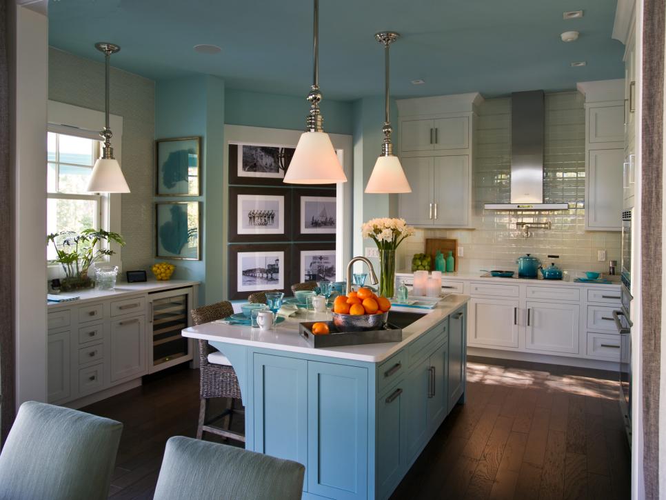 Light Blue Kitchen With White Cabinets, Blue Island and Pendant Lights