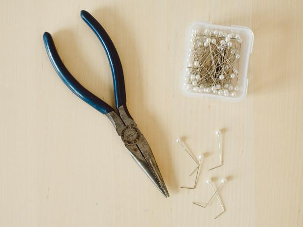 Using pliers, bend pins to create a 90-degree angle, approximately 1/3 of the length up from the pin's pointed end.