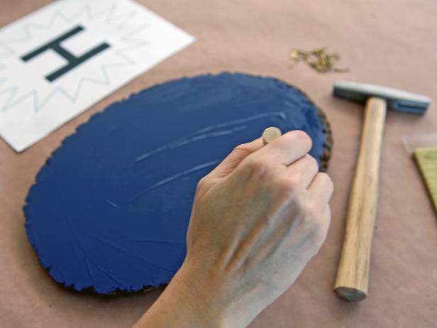 Use foam paintbrush to apply a thin coat of acrylic paint to wood plaque.