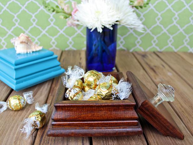 Turn inexpensive fence-post caps into a pretty jewelry or gift box. By itself, the box makes a thoughtful birthday, Mother's Day or holiday gift. Fill it with sweet treats or a small trinket for a handmade gift they won't soon forget. Get crafting to make your own with our <a target="blank" href="http://www.hgtv.com/design/make-and-celebrate/handmade/easy-to-craft-handmade-jewelry-box">step-by-step instructions</a>.