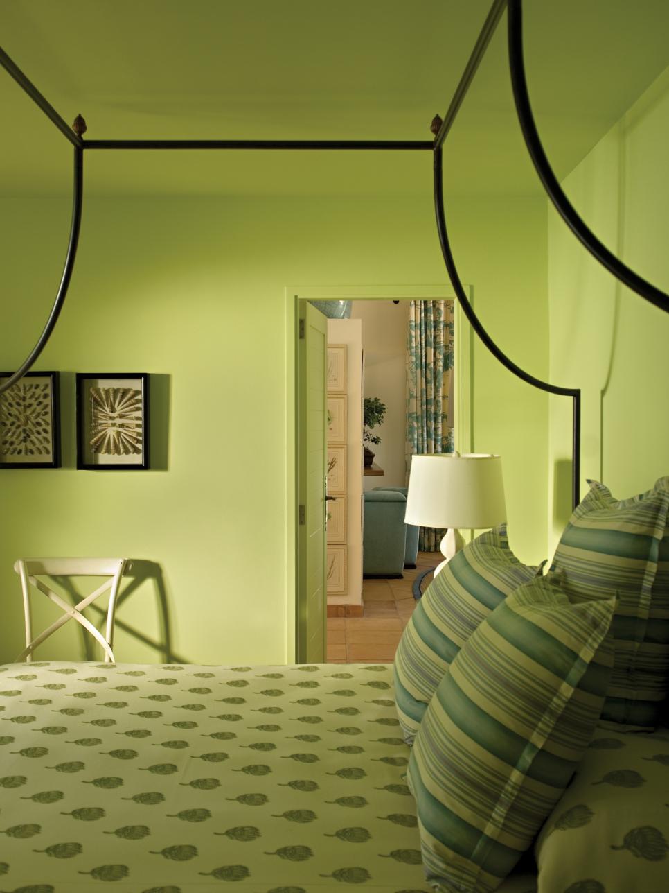 Bedroom with Canopy Bed and Green Walls