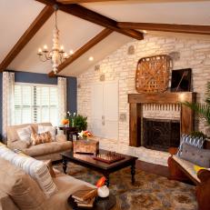 Living Room With White Stone Wall 