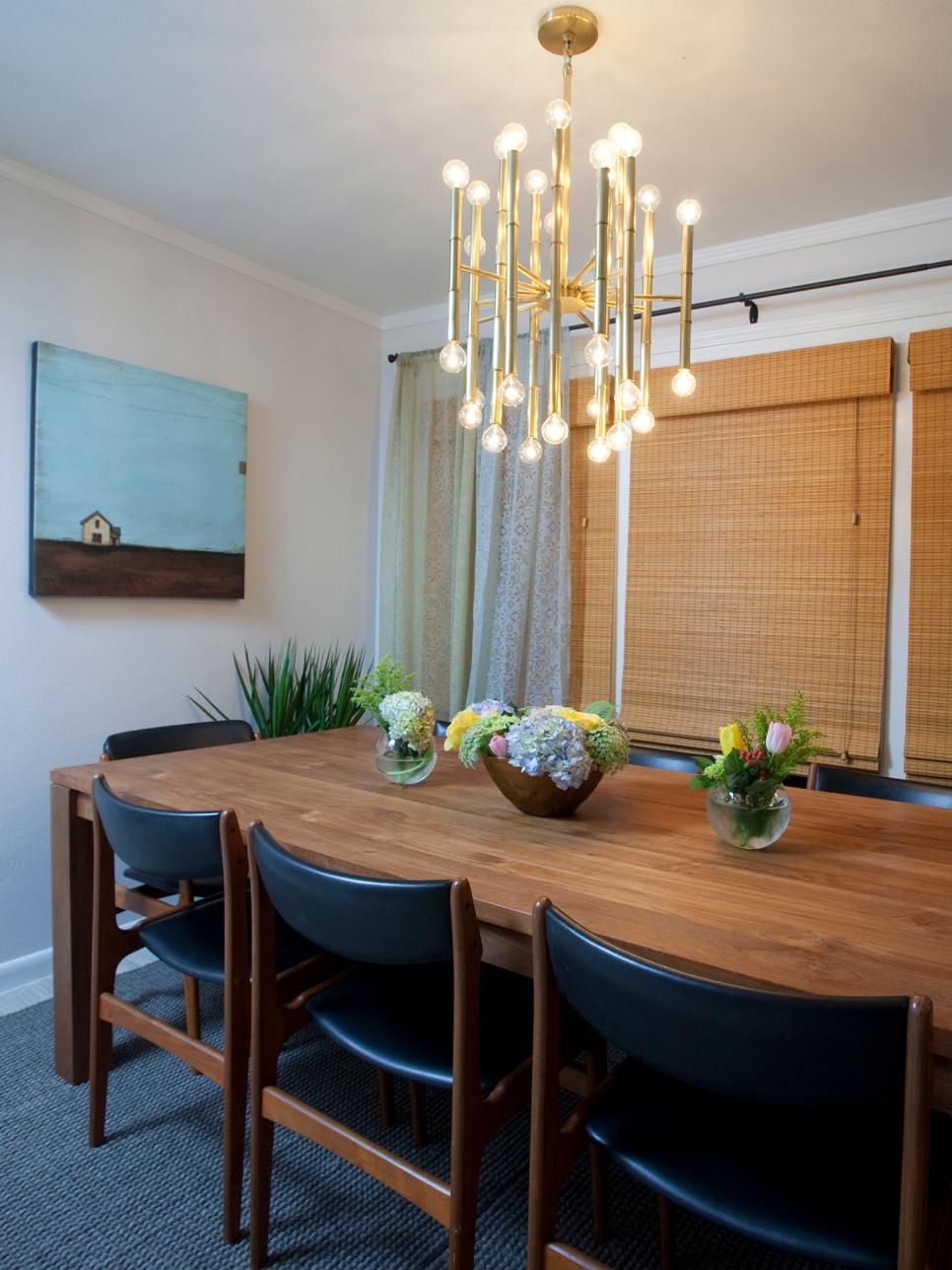 Wood table in dining room with midcentury modern chairs