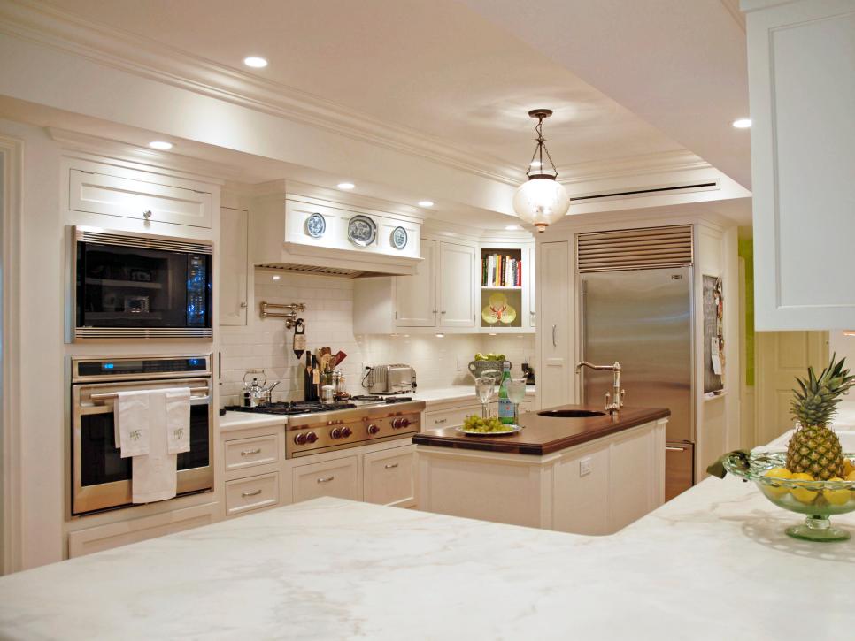 Traditional White Kitchen With Center Island and Long Counters