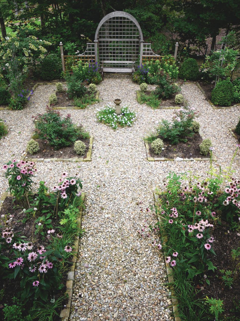 Formal Garden With Lattice Gate Formal Garden With Pebble Paths, Square Flower Beds And Lattice Gate