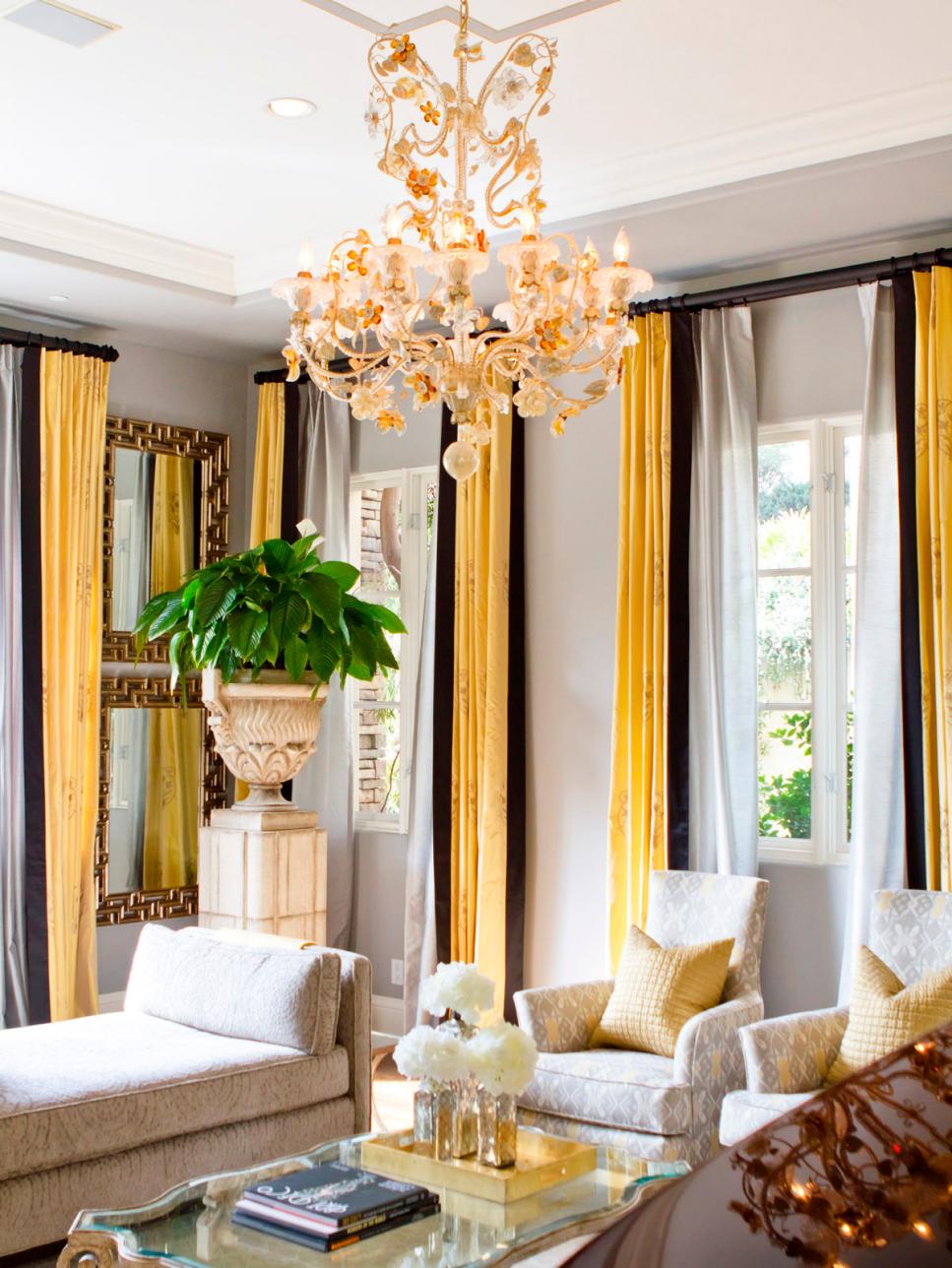 Glamorous Gold and Gray Living Room With Floral Chandelier