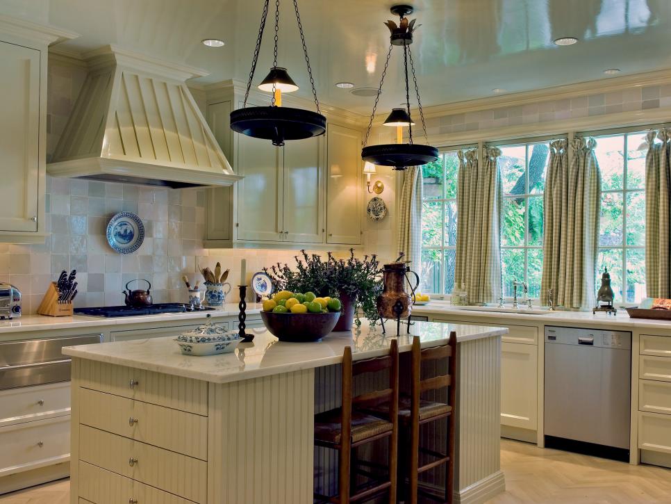 Kitchen With Cream Cabinets, Island and Iridescent Tile Backsplash
