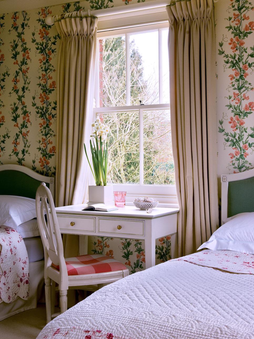 shabby chic bedroom with a desk area sandwiched between twin beds