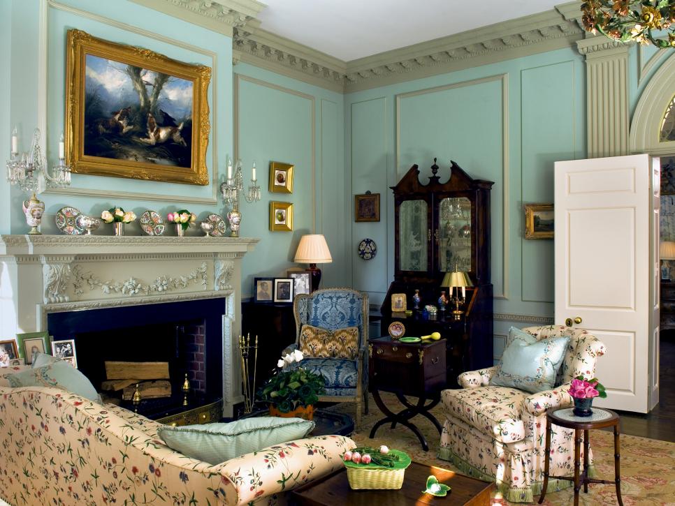 Family Room With Bright Blue Walls, Floral Furniture and Ornate Mantel