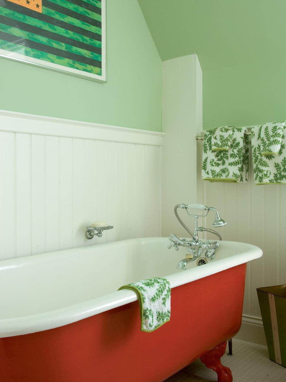 Red Claw-Foot Tub in Green Bathroom With White Beadboard