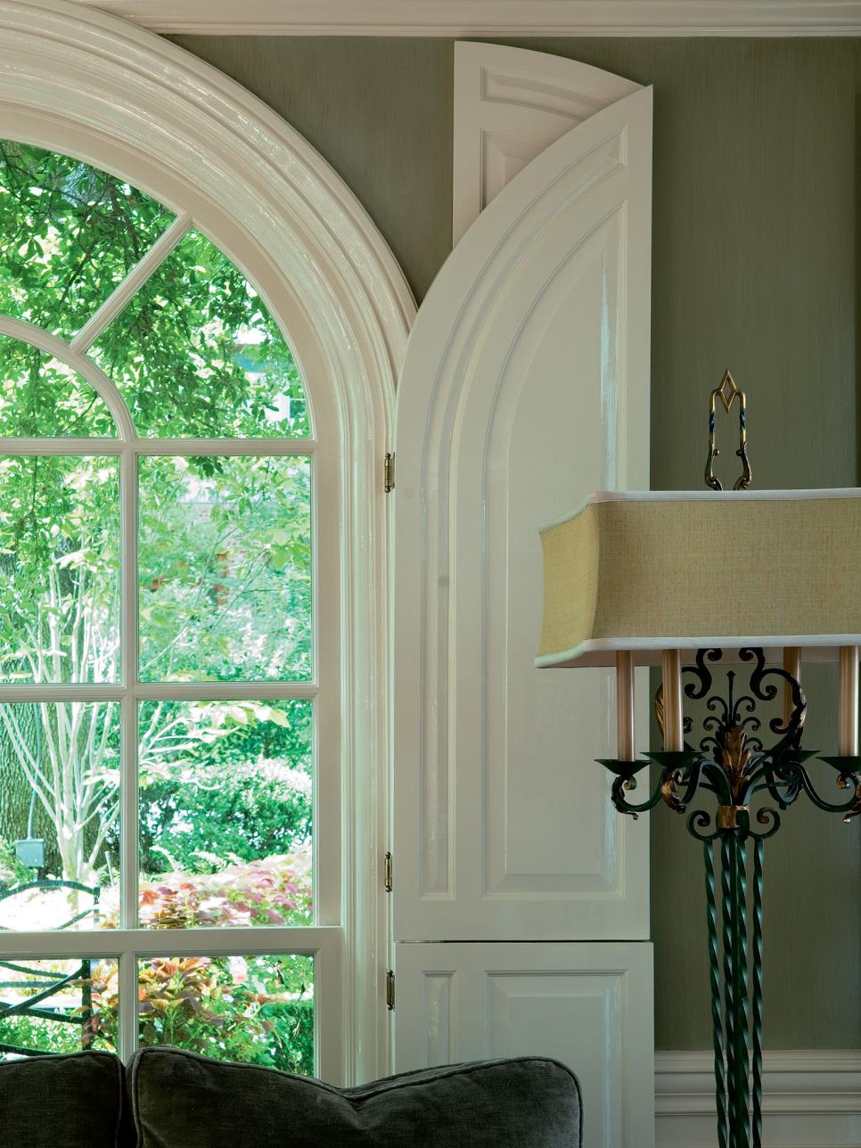 Arched Windows with Green Walls Overlooking a Garden