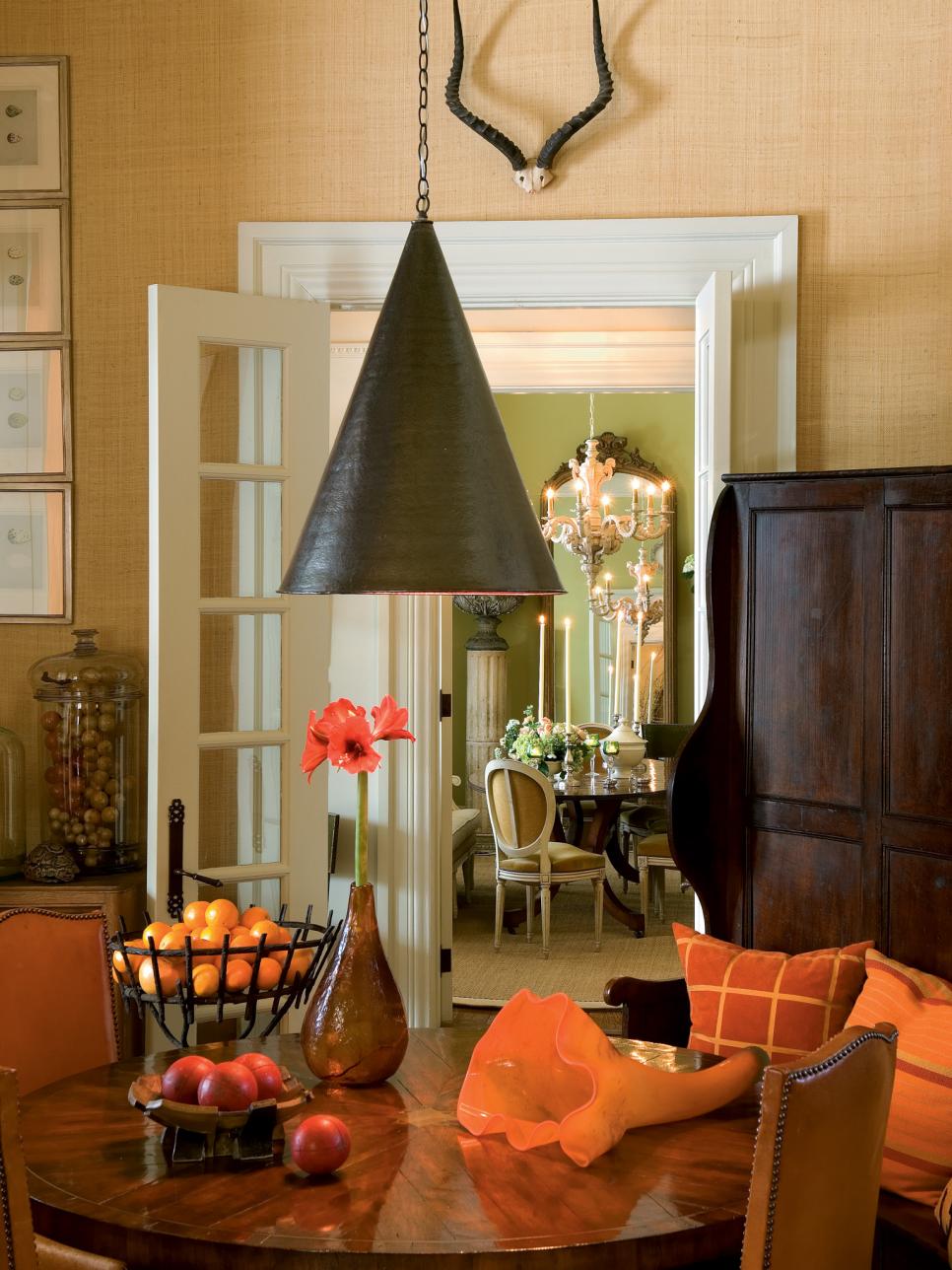 Dining Nook With Wood Dining Table, Cone Light Fixture & Orange Tones