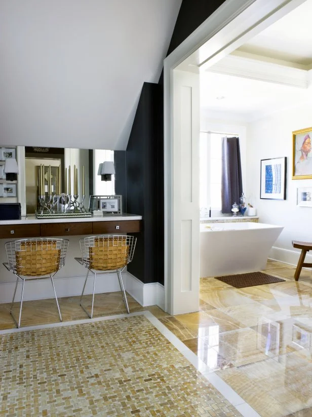 Eclectic Main Bathroom With Onyx Tile Floor and Art Over the Bathtub