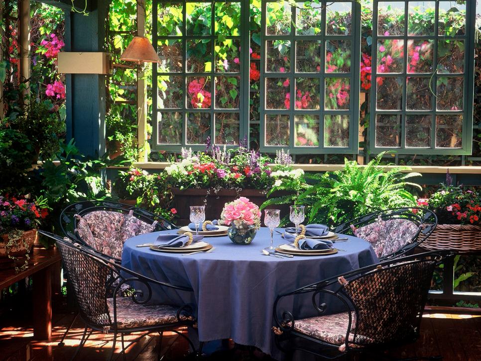Tropical Outdoor Dining Space With Flowers