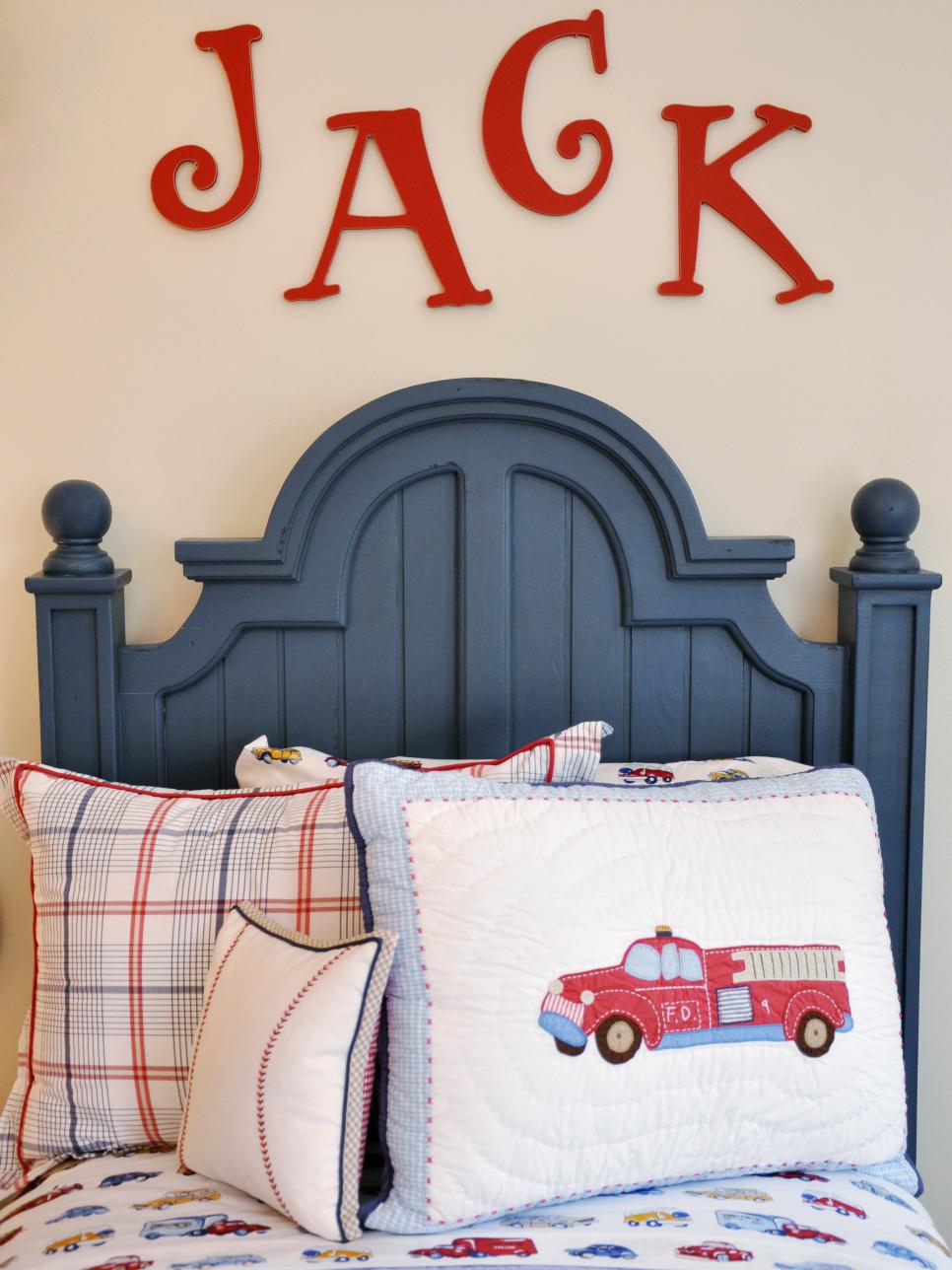Boys Bedroom With Blue Headboard and Transportation-Themed Bedding 