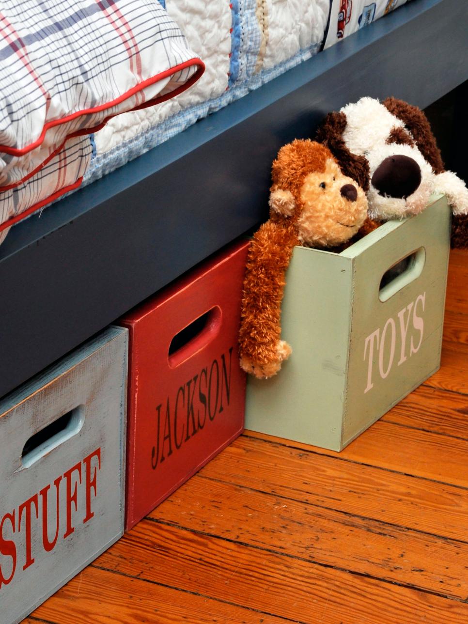 Wooden Storage Boxes Under Blue Bed in Boy's Bedroom