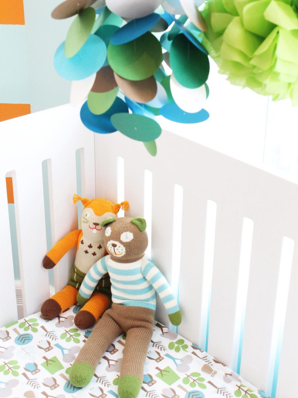 Contemporary Blue, Green and oran Baby Nursery and White Crib