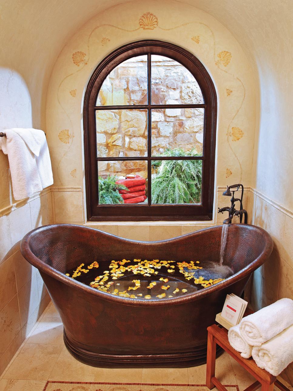 Mediterranean Bathroom With Copper Soaking Tub