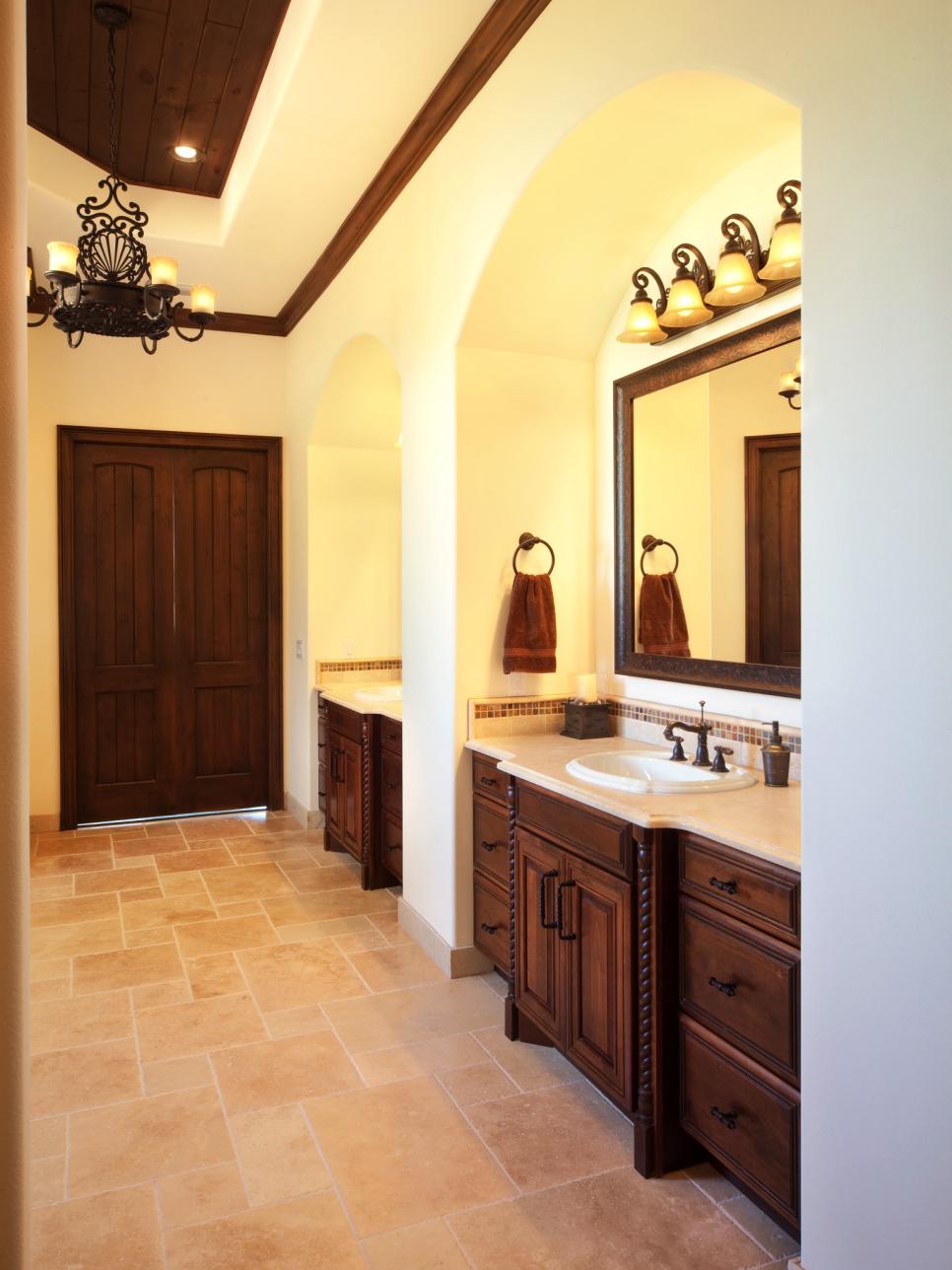 Brown and Cream Master Bathroom With Wood Vanities 