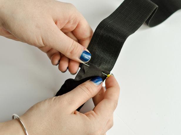 Pin and sew the elastic band to create the skirt's waistband.