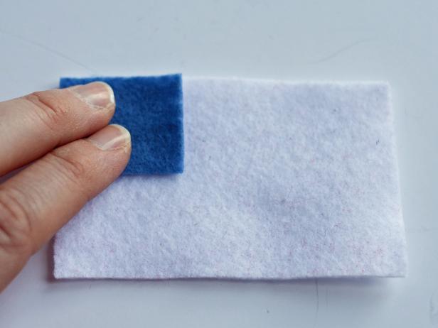 Create patches by cutting then piecing together pieces of felt with fabric glue. Make flags, stars, chevrons, ribbons or medals — let your imagination go wild.