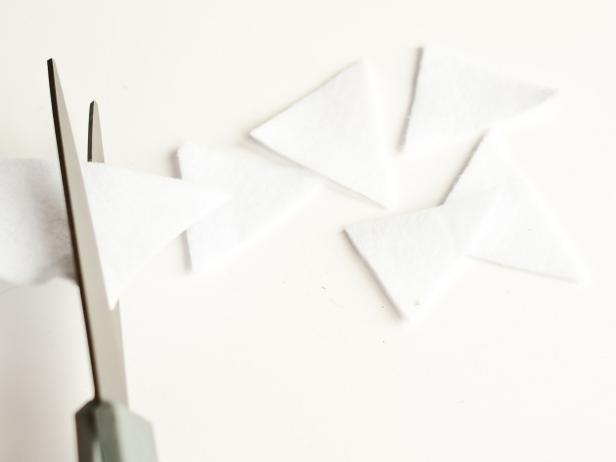 Cut white felt into triangles for "teeth".