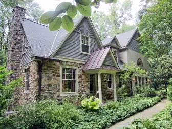 Stone Cottage With Green Foliage 