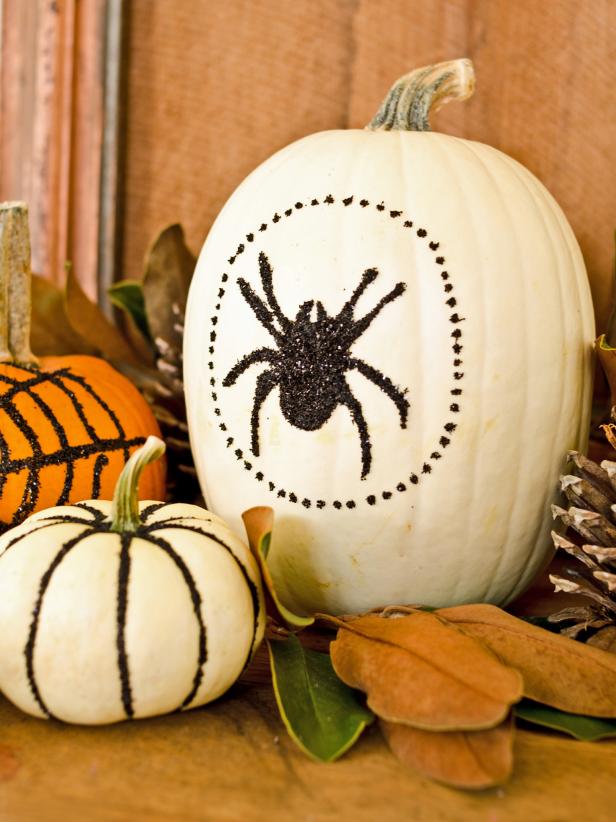 For a fun and easy Halloween crafting project, give plain pumpkins a glamorous makeover using school glue and black glitter.
