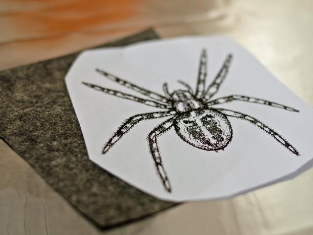 Step 1: Sketch or Trace DesignChoose a Halloween-themed design or graphic, scale it to a size appropriate for pumpkin and print it on standard printer paper then cut off excess paper around image to make it more manageable and also cut a piece of graphite transfer paper roughly the same size as graphic