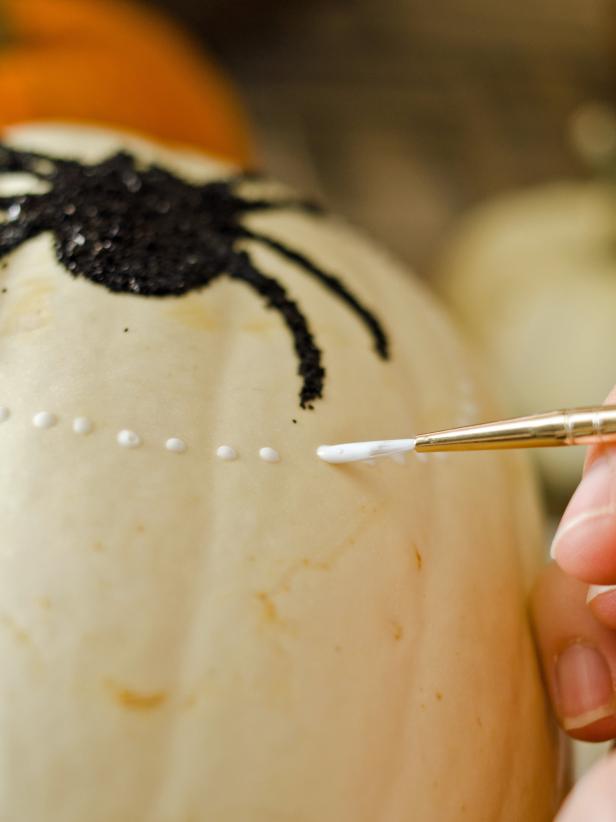 If adding additional embellishments, apply glue with the bottle tip or brush and sprinkle with glitter. Add embellishments one at a time.