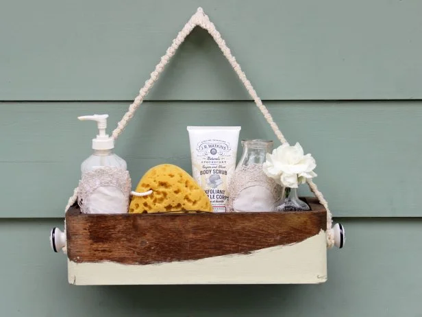 Rustic bathroom caddy made from an old wooden box. 