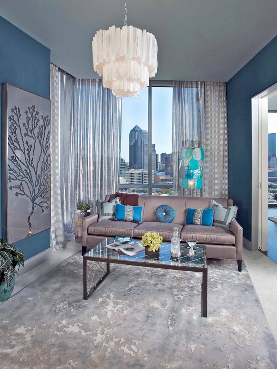 Blue and Gray Contemporary Living Room With White Chandelier