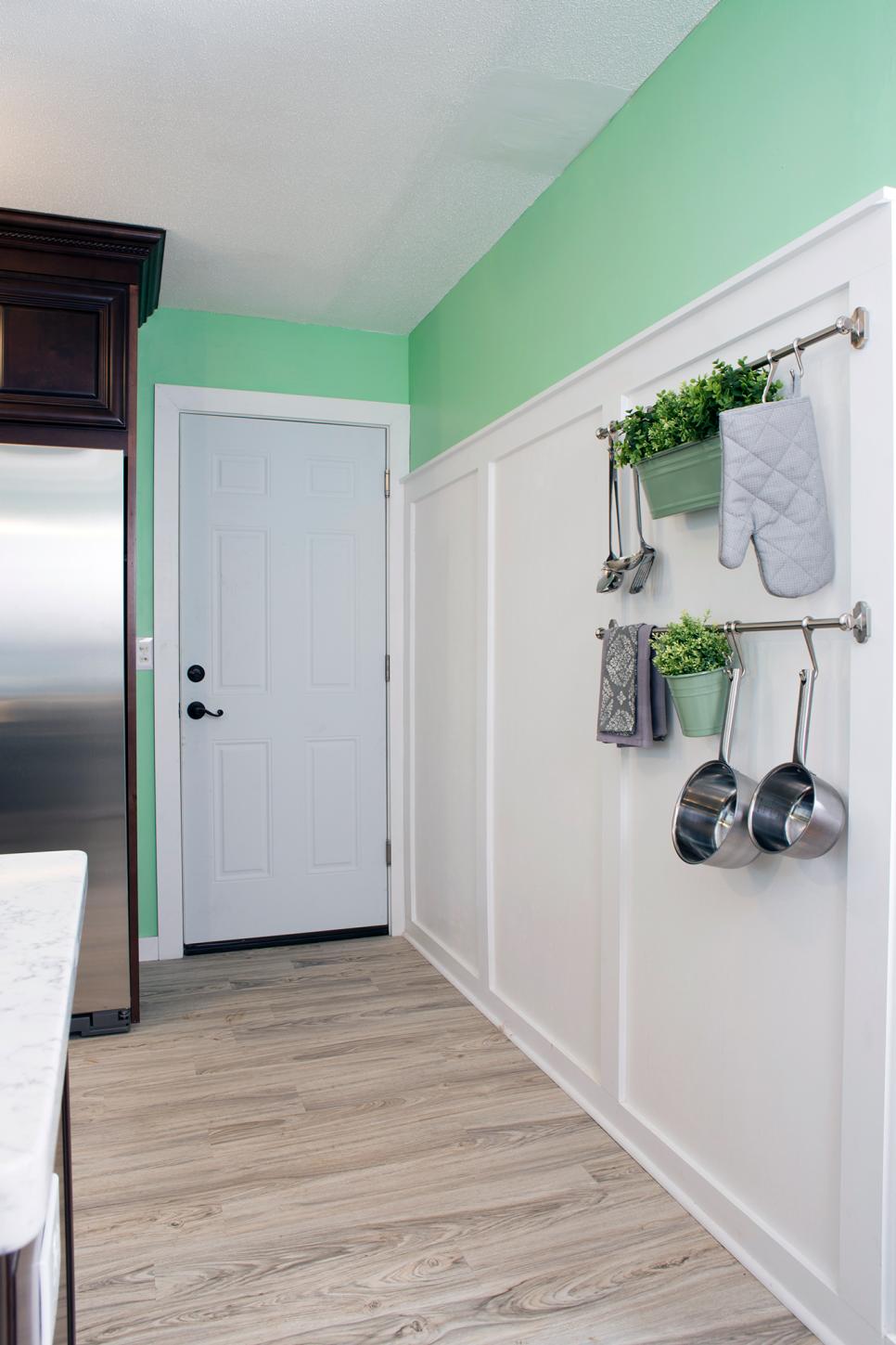 Cottage Kitchen With White Wall Paneling and Hanging Rack Mint Green Cottage Kitchen With White Paneled Wall