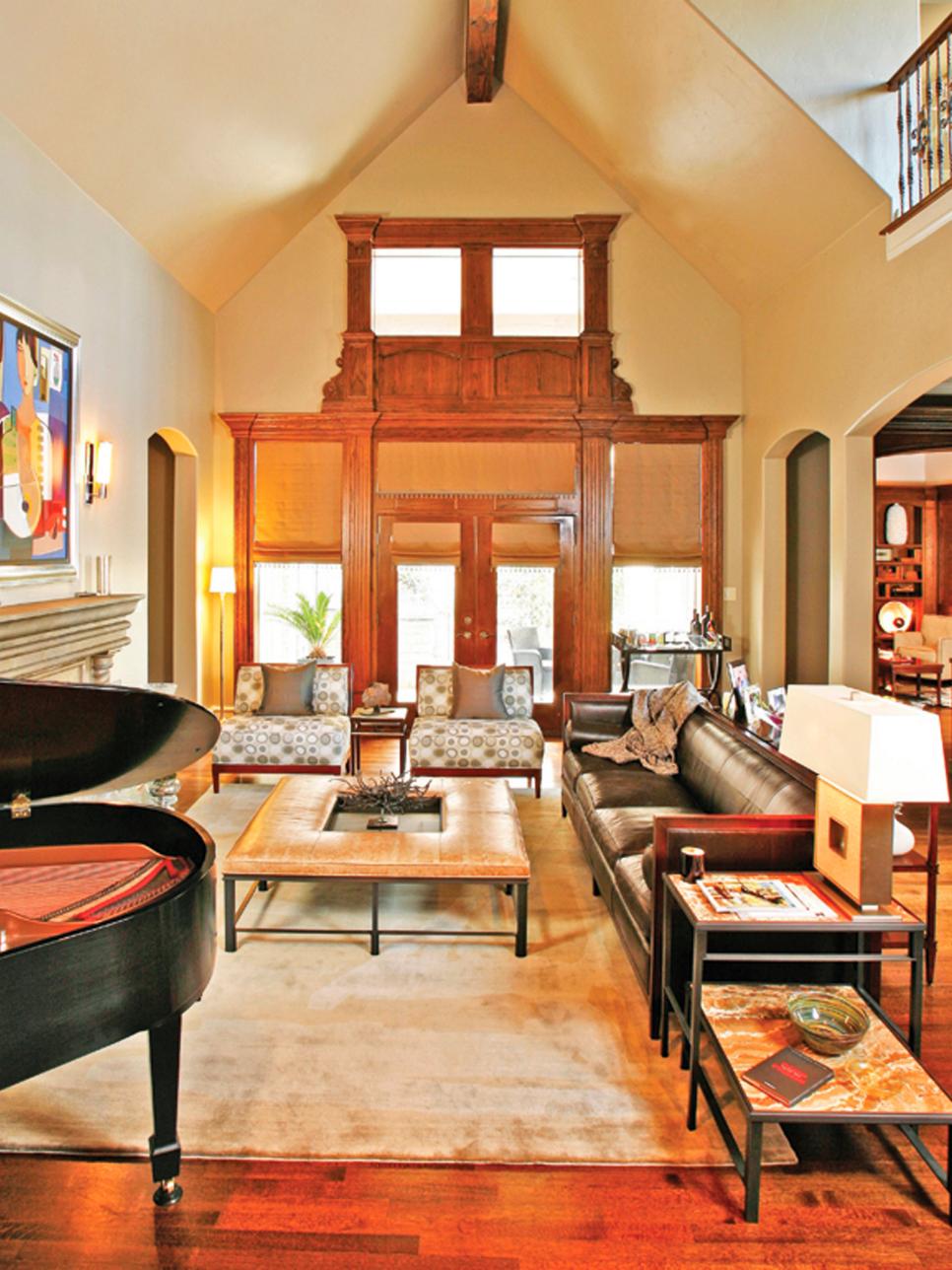 Eclectic Living Room With Grand Wooden Entryway in Background 