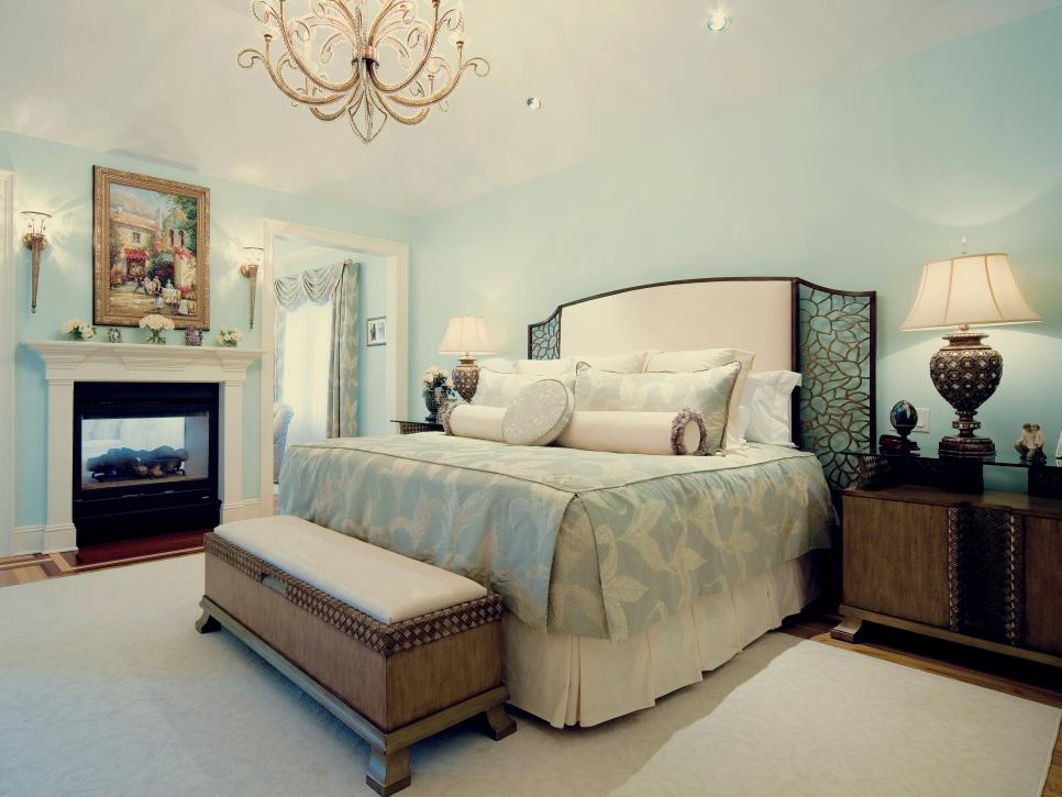 Light Blue Master Bedroom With Bench and Chandelier