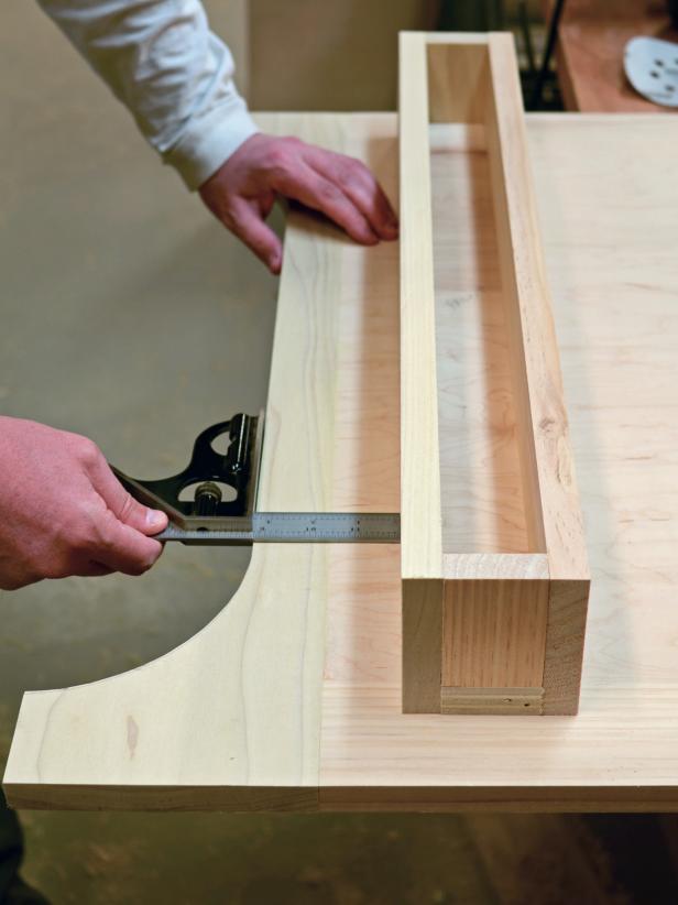 When making the front shelf to your custom range hood, use combo square to determine proper placement of the shelf on the front panel.