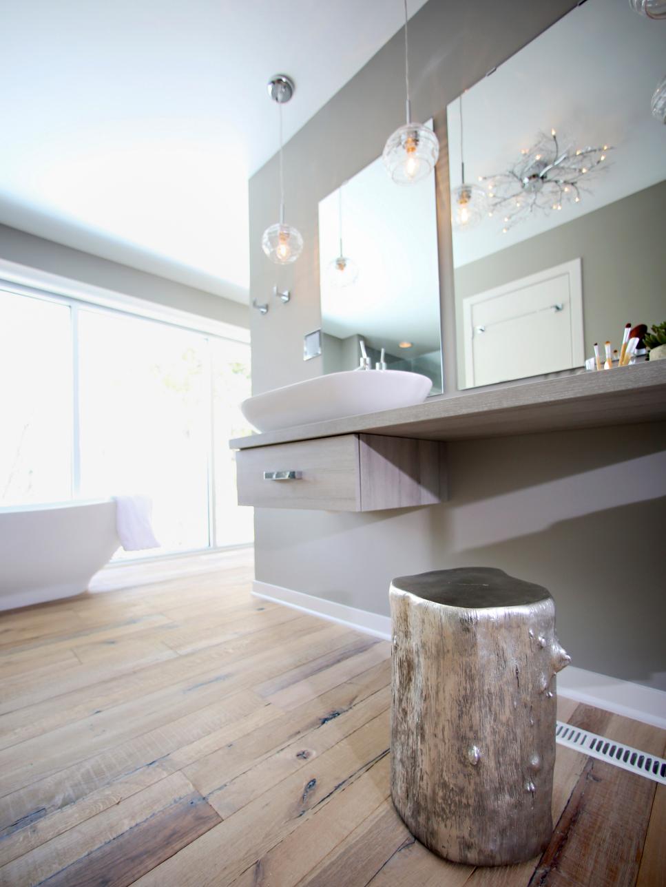 Gray Bathroom With Silver Tree Stump and Vessel Sink