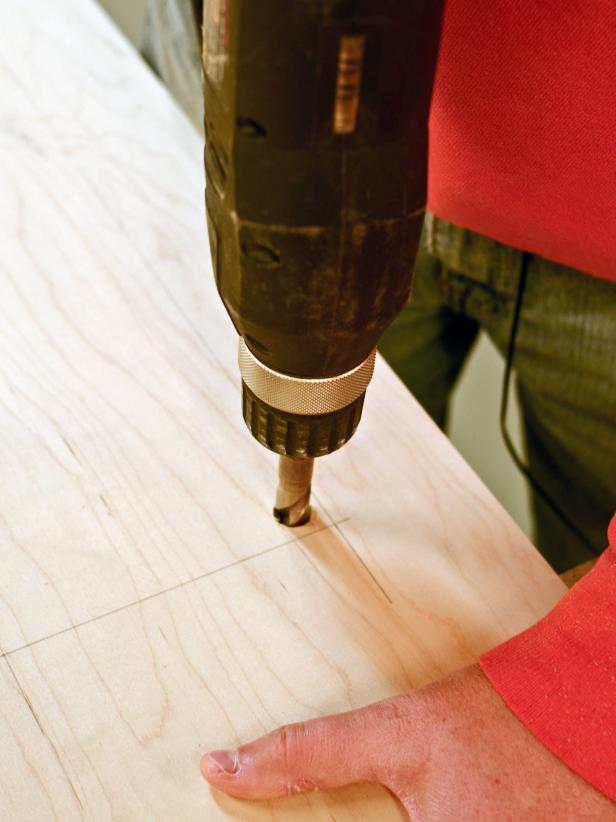 When measuring and cutting wood for the construction of your custom range hood, drill inside the area marked to be cut out with a 1/4" drill bit.