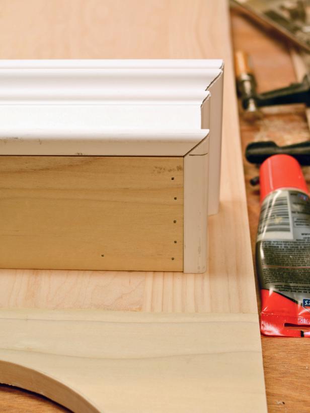 To ensure proper construction when putting together a the shelf for a custom range hood, dry-fit the front and sides to the shelf before nailing the pieces into place.